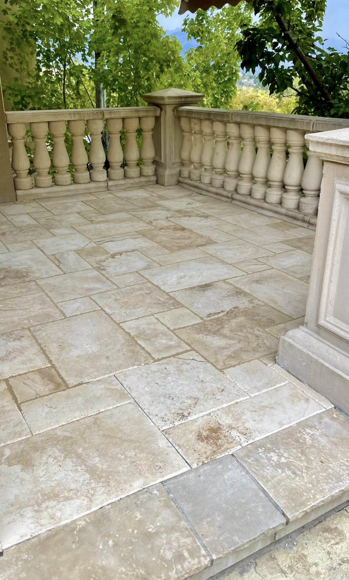 Outdoor stone tile patio installation